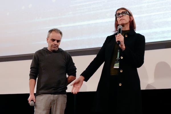 Director Joel Souza, left, and cinematographer Bianca Cline, right, attend the premiere of the film 'Rust' during the 32nd Camerimage International Film Festival in Torun, Poland, Wednesday, Nov. 20, 2024. (AP Photo/Czarek Sokolowski)