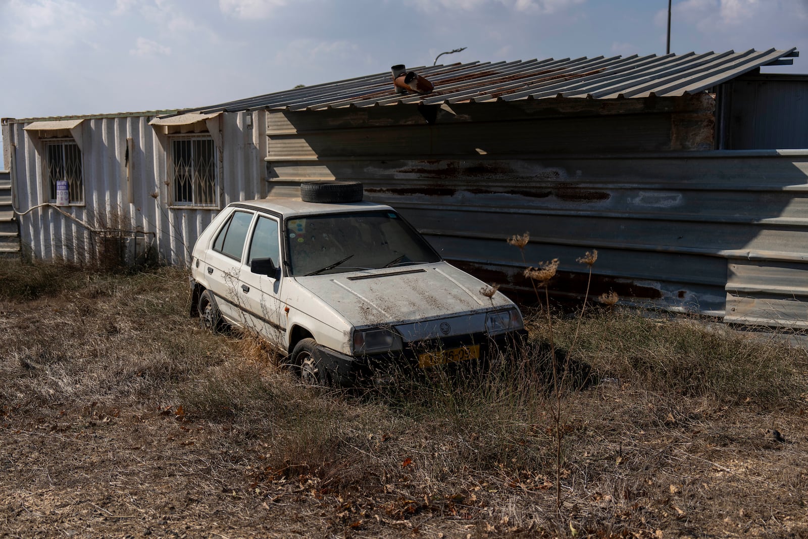 An old car inside the tiny settlement of "Trump Heights" in the Israeli-controlled Golan Heights, where the Israeli residents are welcoming the election of their namesake. They hope Donald Trump's return to the U.S. presidency will breathe new life into the community. Thursday, Nov. 7, 2024. (AP Photo/Ariel Schalit)