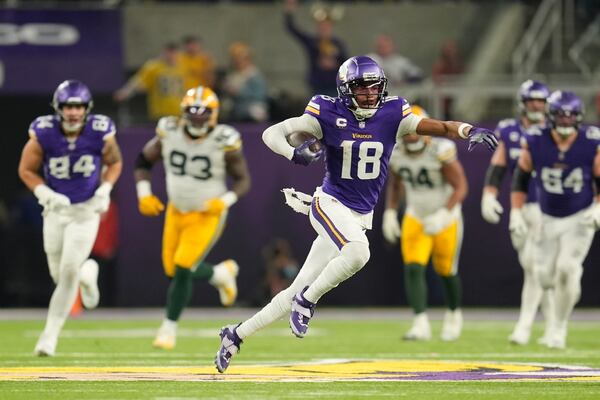 Minnesota Vikings' Justin Jefferson catches a pass for a first down during the second half of an NFL football game against the Green Bay Packers Sunday, Dec. 29, 2024, in Minneapolis. (AP Photo/Abbie Parr)