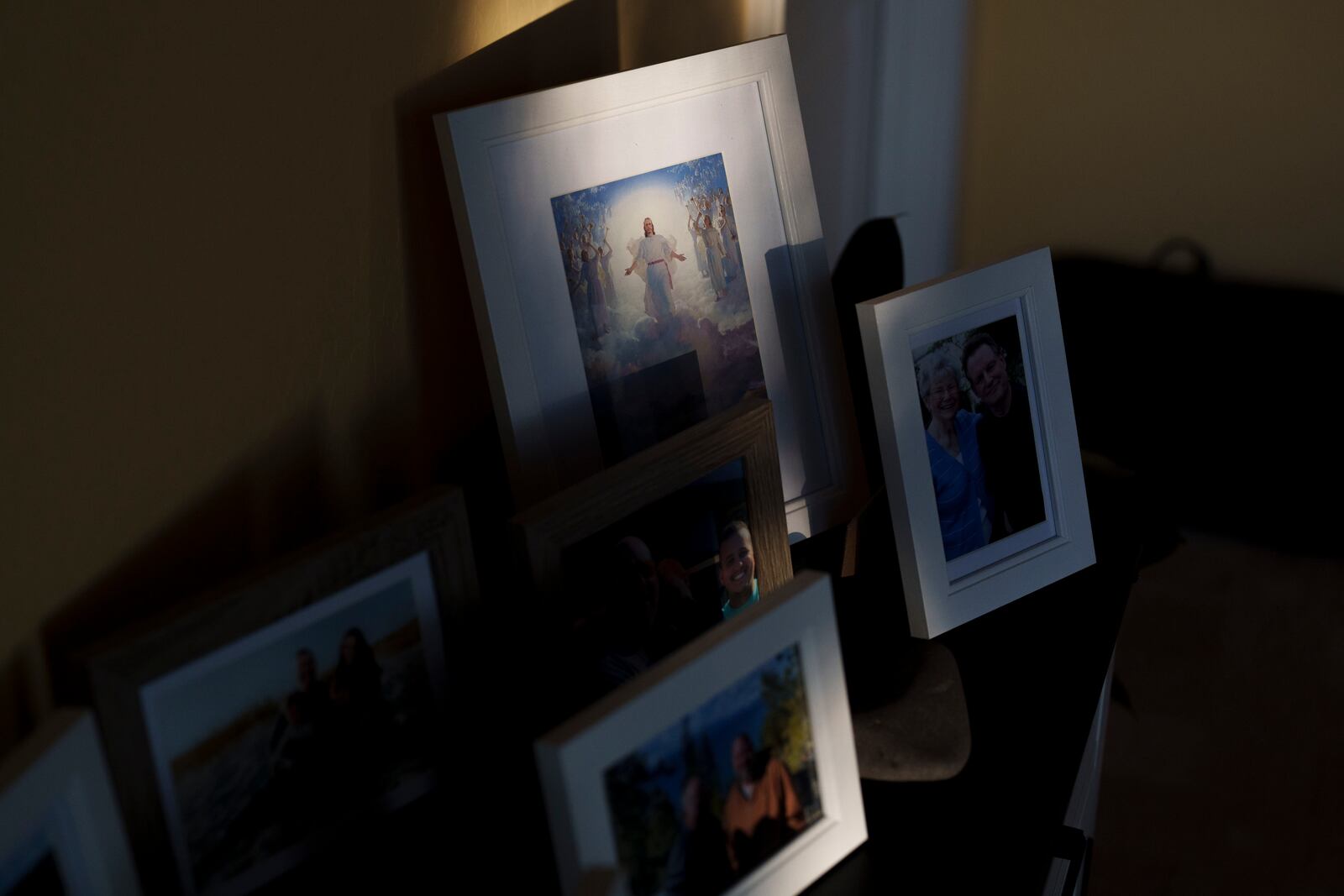 Window light illuminates a depiction of Jesus at the home of Cari-Ann Burgess, Friday, Sept. 20, 2024, in Reno, Nev. (AP Photo/John Locher)