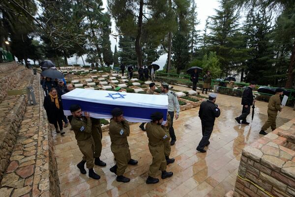 Israeli soldiers carry the flag-draped casket of 1st Sgt. Yuval Shoham during his funeral at the Mount Herzl military cemetery in Jerusalem, Monday, Dec. 30, 2024. (AP Photo/Matias Delacroix)