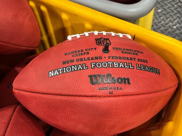 A bin of official balls for the NFL Super Bowl football game wait to be shipped inside the Wilson Sporting Goods football factory, Monday, January 27, 2025, in Ada, Ohio. (AP Photo/Patrick Aftoora-Orsagos)