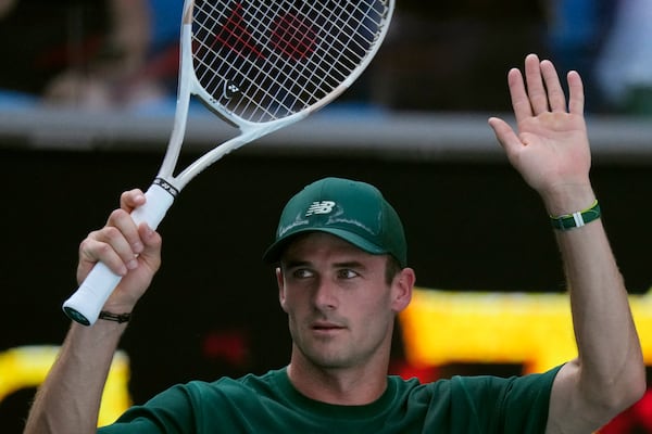 Tommy Paul of the U.S. celebrates after defeating Alejandro Davidovich Fokina of Spain in a fourth round match at the Australian Open tennis championship in Melbourne, Australia, Sunday, Jan. 19, 2025. (AP Photo/Vincent Thian)