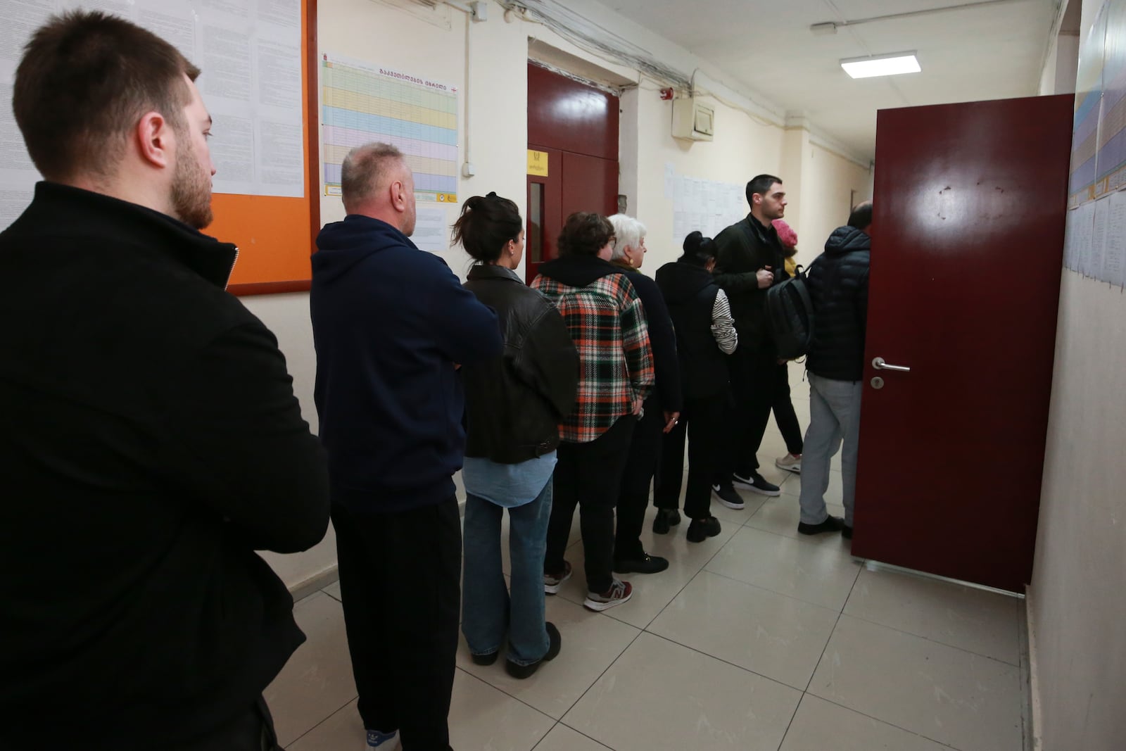 People queue to vote at a polling station during the parliamentary election in Tbilisi, Georgia, Saturday, Oct. 26, 2024. (AP Photo/Zurab Tsertsvadze)