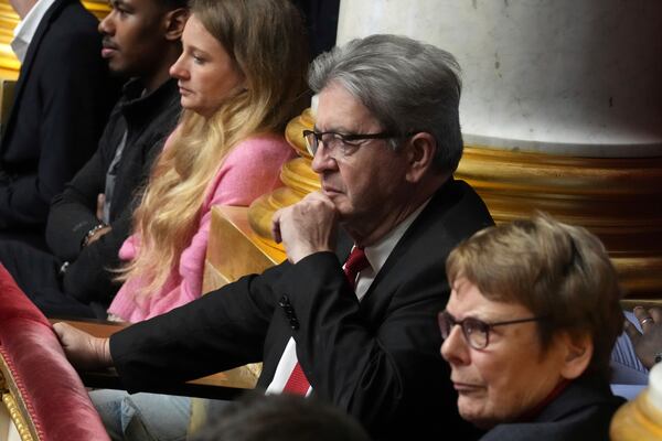 French far-left leader Jean-Luc Melenchon listens to speeches rom the tribunes at the National Assembly prior to a no-confidence vote that could bring down the Prime Minister and the government for the first time since 1962, Wednesday, Dec. 4, 2024 in Paris. (AP Photo/Michel Euler)