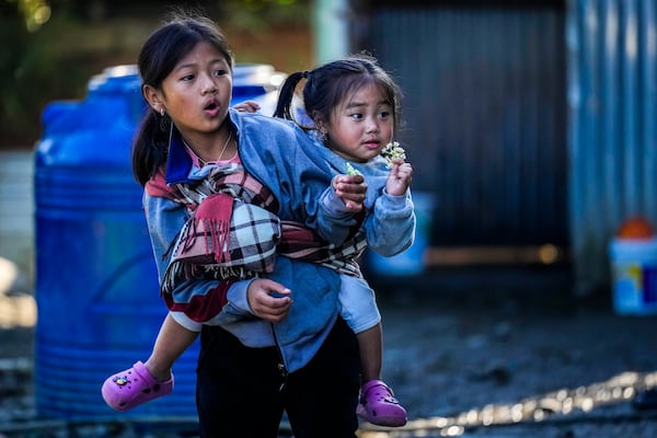 Kuki tribal children play outside their relief camp in Kangpokpi, Manipur, Sunday, Dec. 15, 2024. (AP Photo/Anupam Nath)