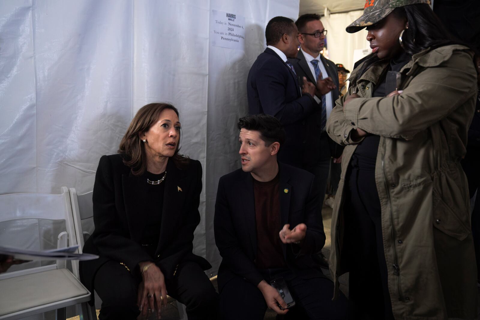 Democratic presidential nominee Vice President Kamala Harris, left, speaks with Ike Irby, senior advisor to the vice president, and Kirsten Allen, communications director to the vice president, shortly before taking the stage for Harris' final campaign rally, Monday, Nov. 4, 2024, in Philadelphia. (AP Photo/Jacquelyn Martin)