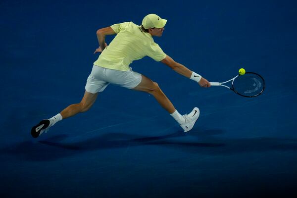 Jannik Sinner of Italy plays a backhand return to Alexander Zverev of Germany in the men's singles final at the Australian Open tennis championship in Melbourne, Australia, Sunday, Jan. 26, 2025. (AP Photo/Manish Swarup)