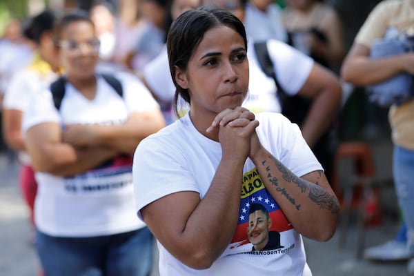 Keylumi Navas, relative of Samuel Borges, waits for his release outside the Yare 3 prison in San Francisco de Yare, Venezuela, Saturday, Nov. 16, 2024. Attorney General Tarek William Saab announced the release of some of those who were detained during a government crackdown following anti-government protests against the results of the presidential election. (AP Photo/Cristian Hernandez)