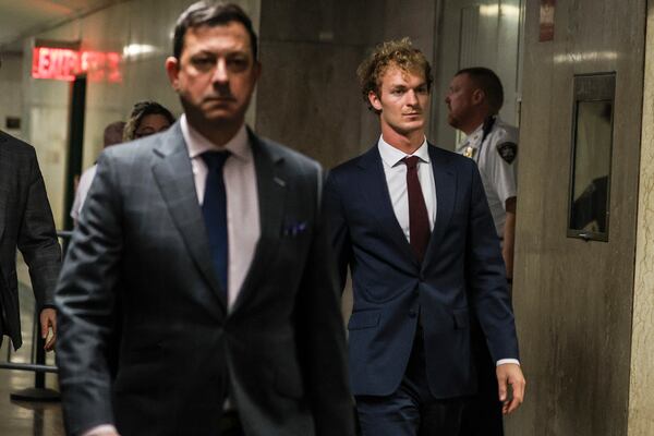 Daniel Penny, right, walks out of the courtroom, next to Thomas Kenniff, left, his lawyer, Wednesday, Dec. 4, 2024, in New York. (AP Photo/Heather Khalifa)