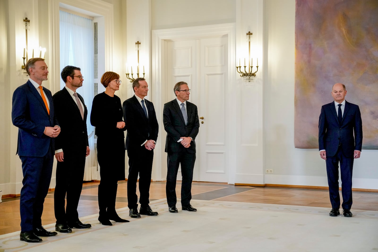 Christian Lindner , former Federal Minister of Finance, Marco Buschmann, former Federal Minister of Justice, Bettina Stark-Watzinger former Federal Minister of Education and Research, Volker Wissing, Federal Minister of Digital Affairs and Transport and Joerg Kukies (SPD), new Federal Minister of Finance, from left, stand together, as German Chancellor Olaf Scholz, right, looks on in the Bellevue Palace in Berlin, Germany, Thursday, Nov.7, 2024. (AP Photo/Ebrahim Noroozi)