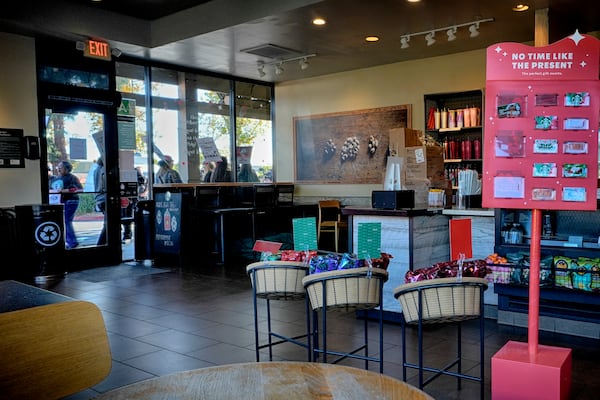 Starbucks workers picket outside of a closed Starbucks location over contract negotiations with the company Friday, Dec. 20, 2024, in Burbank, Calif. (AP Photo/Damian Dovarganes)