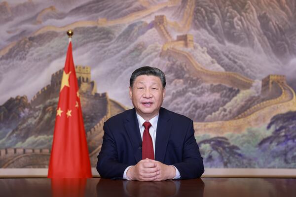 In this photo released by Xinhua News Agency, Chinese President Xi Jinping delivers a New Year message on Tuesday, Dec. 31, 2024 in Beijing to ring in 2025. (Ju Peng/Xinhua via AP)