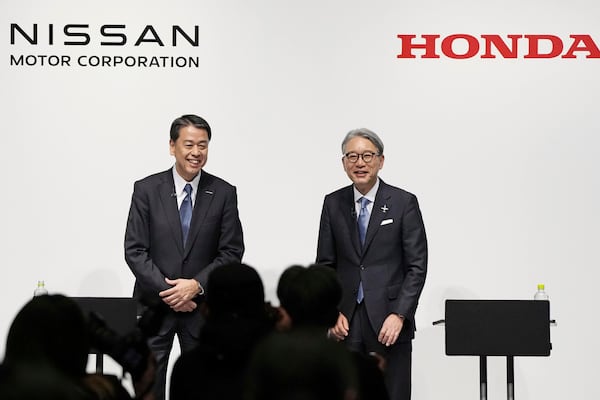 FILE - Nissan Chief Executive Makoto Uchida, left, and Honda President Toshihiro Mibe attend a joint news conference in Tokyo, Friday, March 15, 2024. (Kyodo News via AP, File)