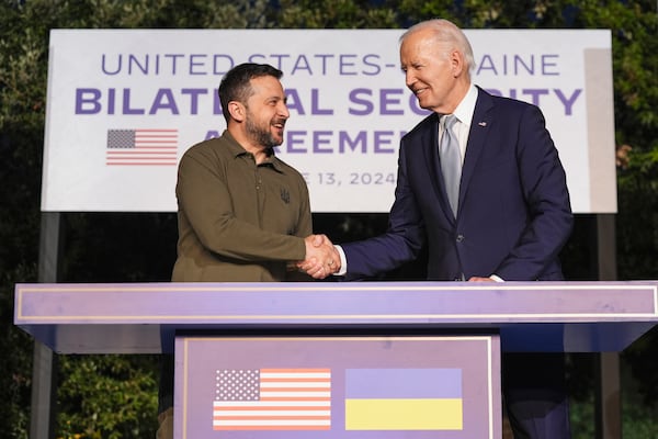 FILE - President Joe Biden and Ukrainian President Volodymyr Zelenskyy shake hands after signing a security agreement on the sidelines of the G7, Thursday, June 13, 2024, in Savelletri, Italy. (AP Photo/Alex Brandon, File)