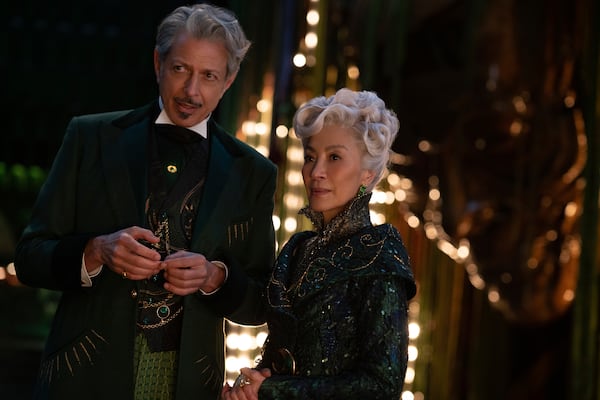 This image released by Universal Pictures shows Jeff Goldblum, left, and Michelle Yeoh in a scene from the film "Wicked." (Universal Pictures via AP)