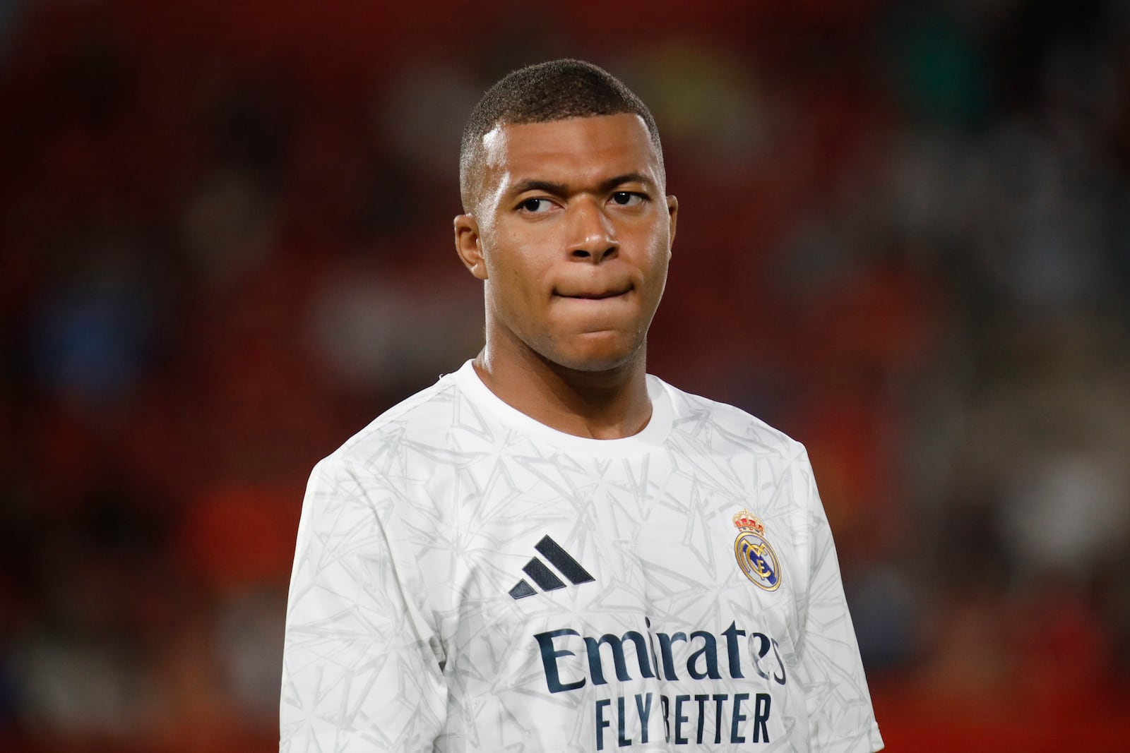 FILE - Real Madrid's Kylian Mbappe looks on before the start of a Spanish La Liga soccer match between Mallorca and Real Madrid at the Son Moix Stadium in Palma de Mallorca, Spain, Sunday, Aug. 18, 2024. (AP Photo/Francisco Ubilla, File)