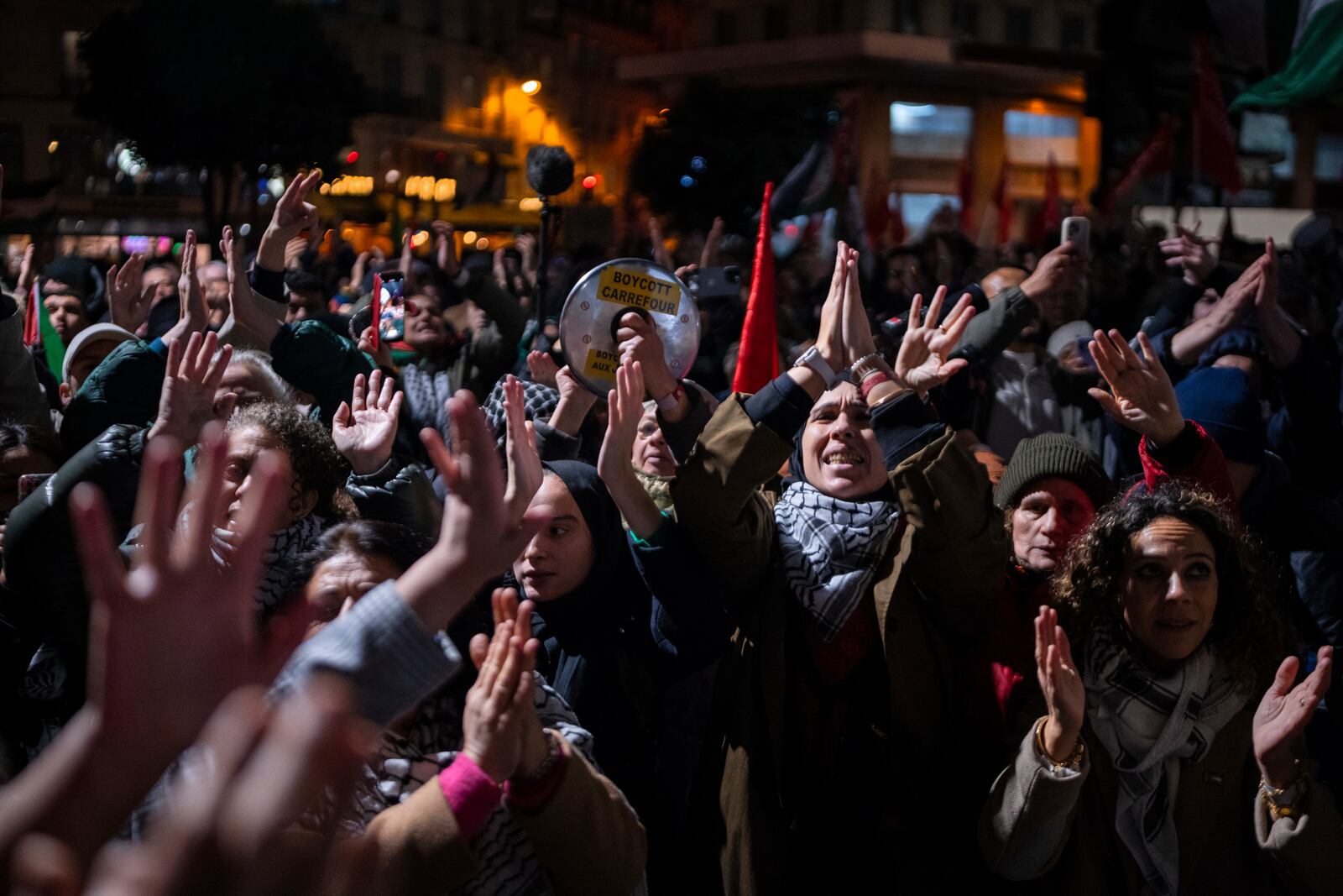 Protestors take part in a rally against the "Israel is Forever" gala organized by far-right Franco-Israeli figures, in Paris, Wednesday, Nov. 13, 2024, on the eve of the UEFA Nations League 2025 soccer match between France and Israel. (AP Photo/Louise Delmotte)