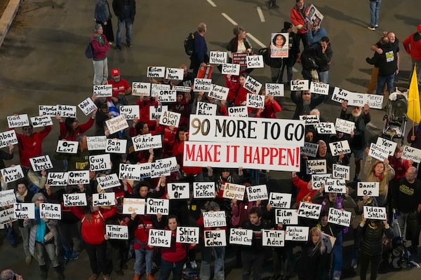 Demonstrators protest calling for the immediate release of the hostages held in the Gaza Strip by the Hamas militant group in Tel Aviv, Israel, Saturday, Jan. 25, 2025. (AP Photo/Ohad Zwigenberg)