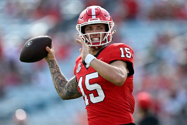 FILE - Georgia quarterback Carson Beck (15) throws before an NCAA college football game against Florida, Saturday, Nov. 2, 2024, in Jacksonville, Fla. (AP Photo/Phelan M. Ebenhack, File)