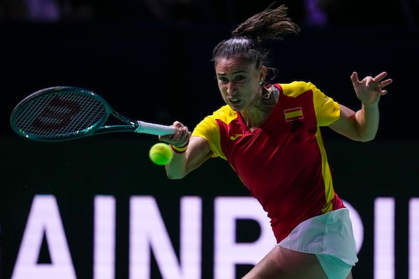 Spain's Sara Sorriber Tormo returns the ball against Poland's Magda Linette during the Billie Jean King Cup Finals, at the Martin Carpena Sports Hall, in Malaga, southern Spain, on Friday, Nov. 15, 2024. (AP Photo/Manu Fernandez)