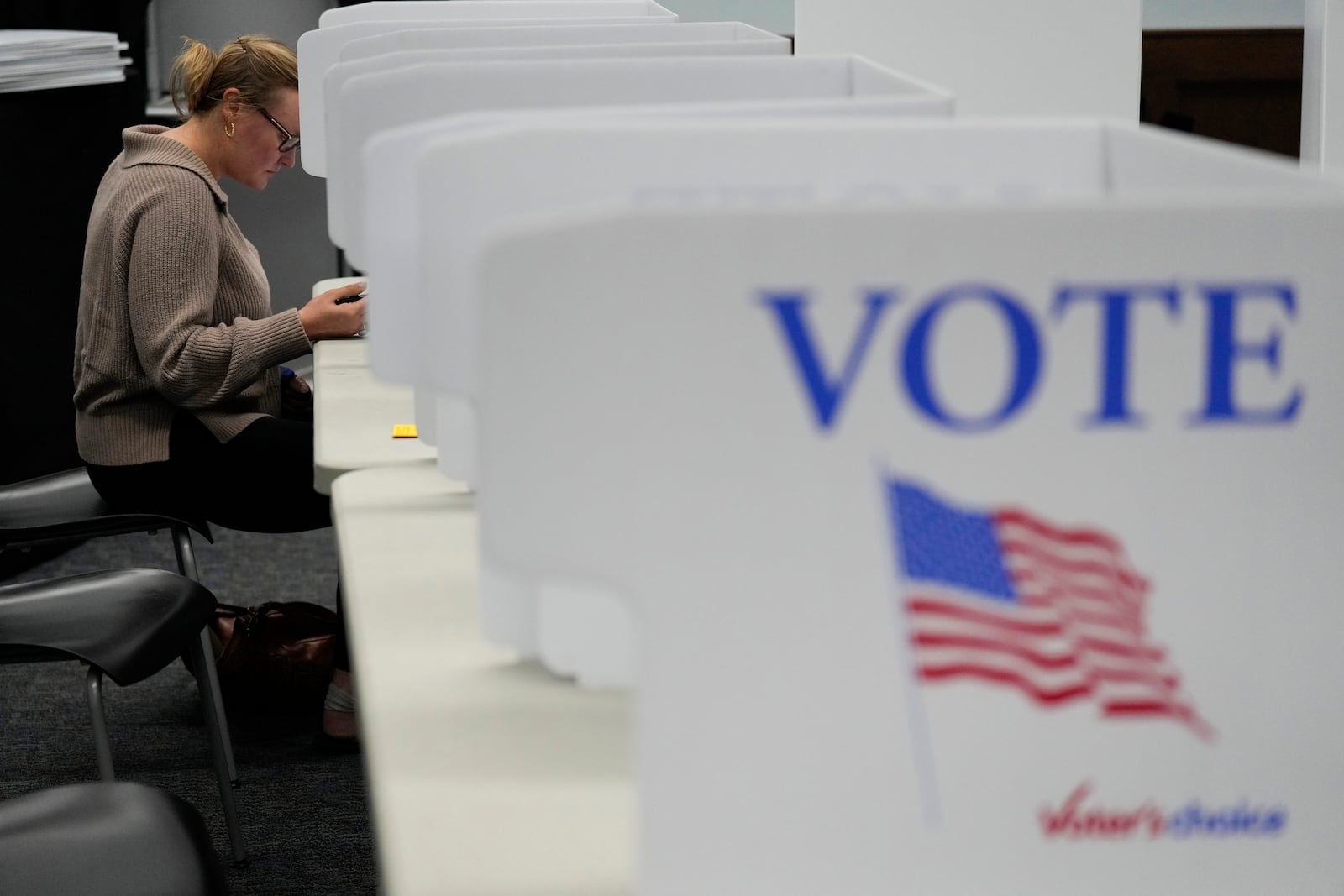 Whitney Cooper casts her ballot on Election Day, Tuesday, Nov. 5, 2024, in Canton, N.C. (AP Photo/George Walker IV)