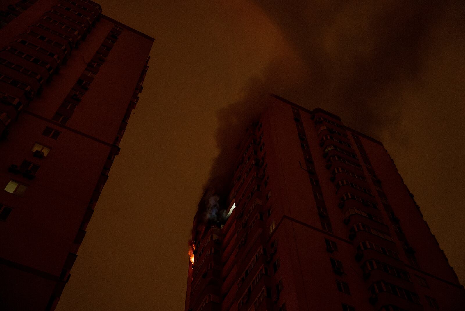 A residential building burns after an attack of Russian drones killed a teenager in Kyiv, Ukraine, Friday, Oct. 25, 2024. (AP Photo/Alex Babenko)