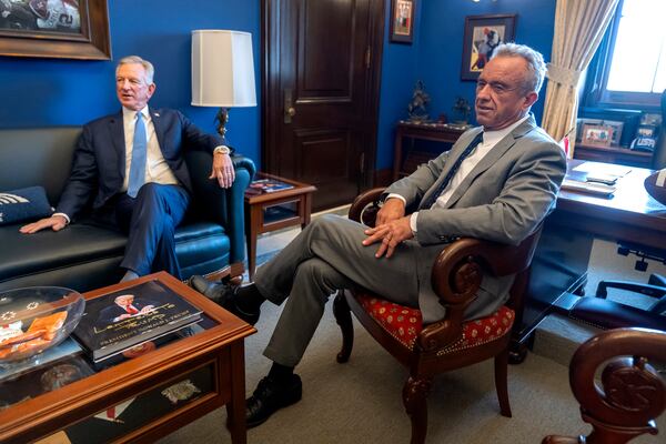 Robert Kennedy Jr., right, President-elect Donald Trump's pick to lead the Health and Human Services Department, meets with Sen. Tommy Tuberville, R-Ala., on Capitol Hill, Tuesday, Dec. 17, 2024, in Washington. (AP Photo/Mark Schiefelbein)