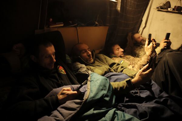 In this photo provided by Ukraine's 24th Mechanised Brigade press service, servicemen of the 24th Mechanised Brigade rest in a shelter on the front line near Chasiv Yar town, in Donetsk region, Ukraine, Tuesday, Nov. 19, 2024. (Oleg Petrasiuk/Ukrainian 24th Mechanised Brigade via AP)