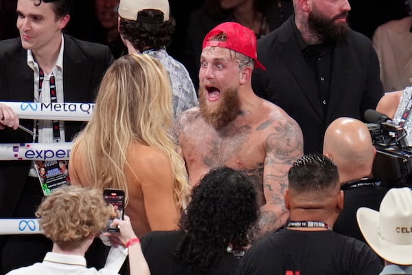 Jake Paul reacts after defeating Mike Tyson during their heavyweight boxing match, Friday, Nov. 15, 2024, in Arlington, Texas. (AP Photo/Julio Cortez)