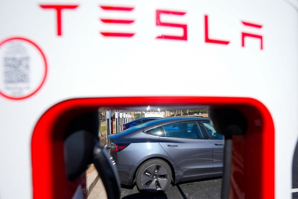 FILE - A Tesla level three Electric vehicle charger is visible, Feb. 2, 2024, in Kennesaw, Ga., near Atlanta. (AP Photo/Mike Stewart, File)