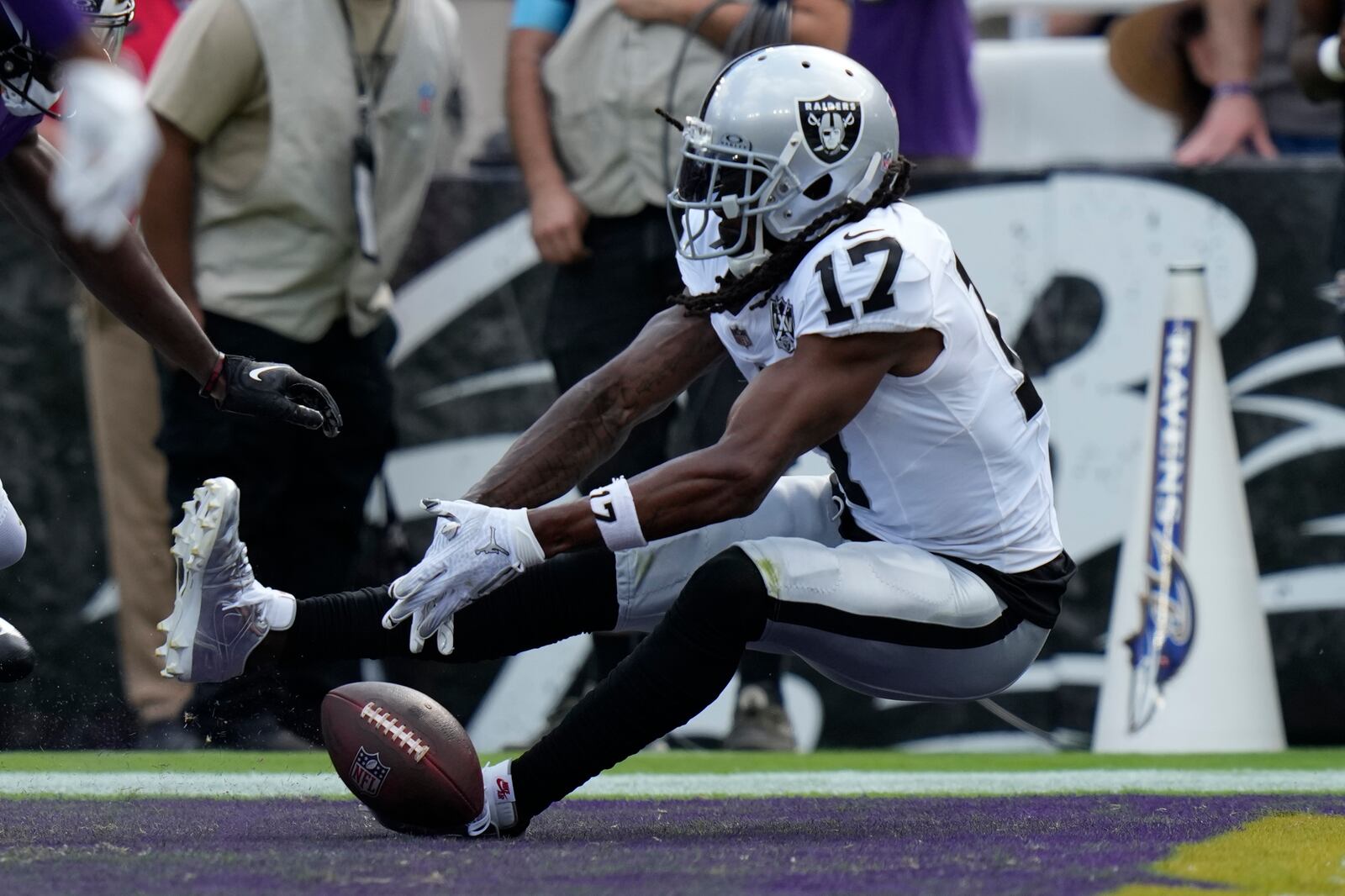 Las Vegas Raiders wide receiver Davante Adams (17) misses a catch attempt against the Baltimore Ravens during the second half of an NFL football game, Sunday, Sept. 15, 2024, in Baltimore. (AP Photo/Stephanie Scarbrough)