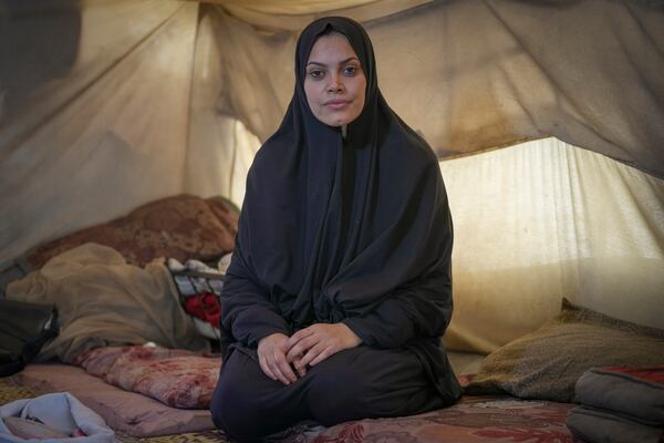 Alaa Hamami poses for a portrait inside her tent at a camp for displaced Palestinians in Deir al-Balah, Gaza Strip, Dec. 18, 2024. (AP Photo/Abdel Kareem Hana)