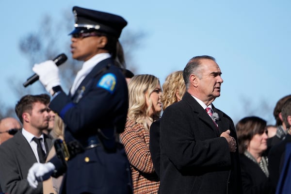 Gov.-elect Mike Kehoe pauses for the singing of the The Star-Spangled Banner before being sworn in as Missouri's 58th Governor Monday, Jan. 13, 2025, in Jefferson City, Mo. (AP Photo/Jeff Roberson)