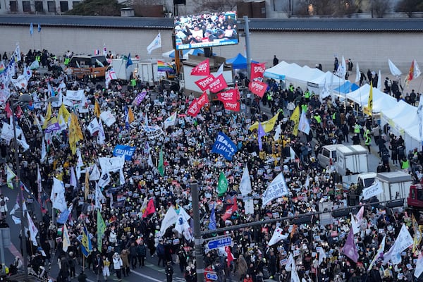 Protesters march during a rally demanding immediate indictment of impeached South Korean President Yoon Suk Yeol in Seoul, South Korea, Saturday, Jan. 25, 2025. (AP Photo/Ahn Young-joon)