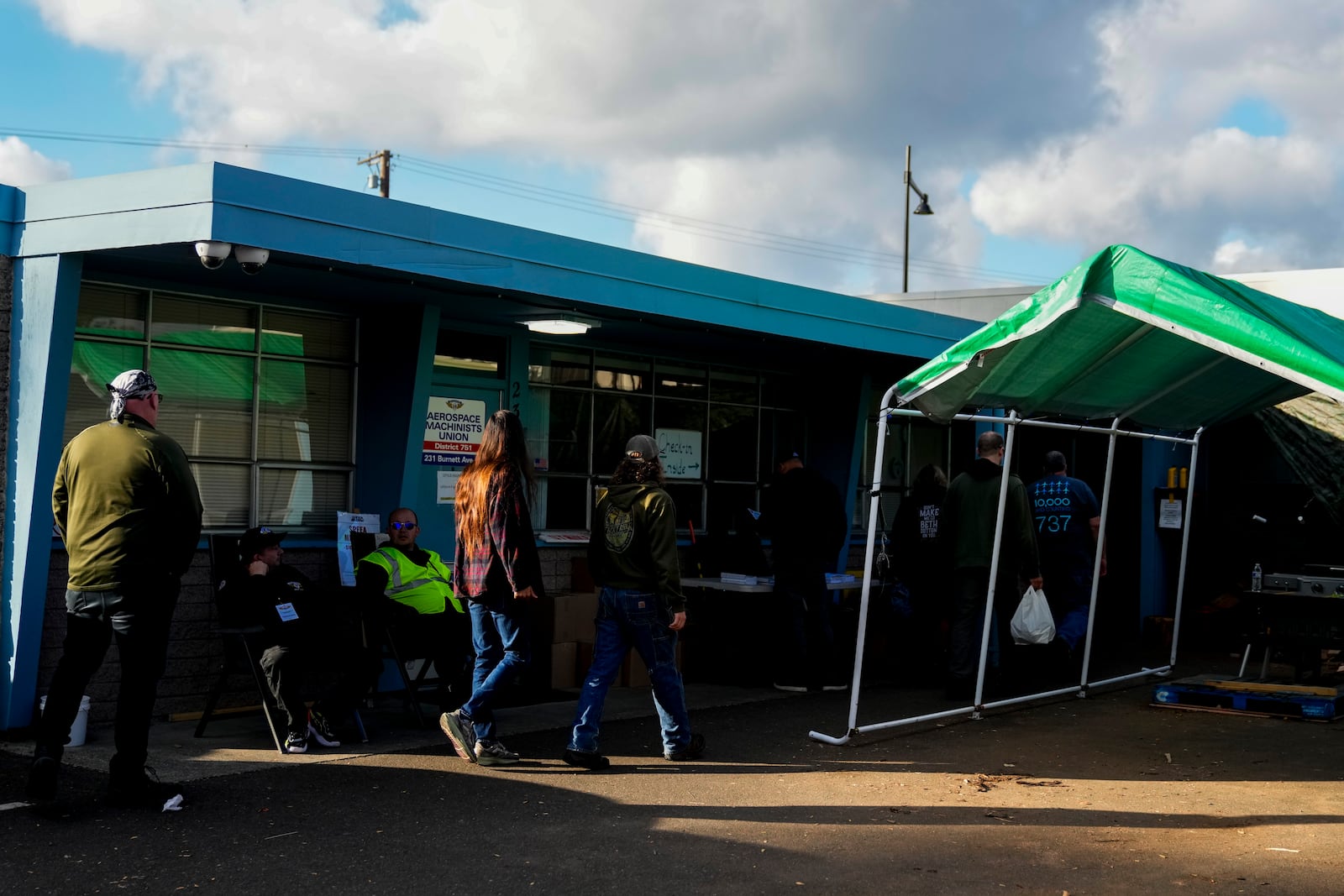 Boeing employees on strike arrive to vote on a new contract offer from the company, Wednesday, Oct. 23, 2024, at the Aerospace Machinists Union hall in Renton, Wash. (AP Photo/Lindsey Wasson)