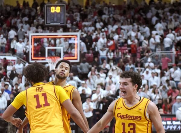 Iowa State's forward Kayden Fish (11) chest-bumps forward Joshua Jefferson, second from left, after their overtime win in an NCAA college basketball game against Texas Tech, Saturday, Jan. 11, 2025, in Lubbock, Texas. (AP Photo/Annie Rice)