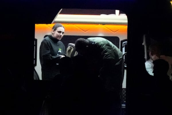 Israeli Romi Gonen, who was kidnapped in Gaza by Hamas on Oct. 7, steps out of a van before boarding a helicopter after being released from Gaza, southern Israel, Sunday, Jan. 19, 2025. (Photo/Ohad Zwigenberg)