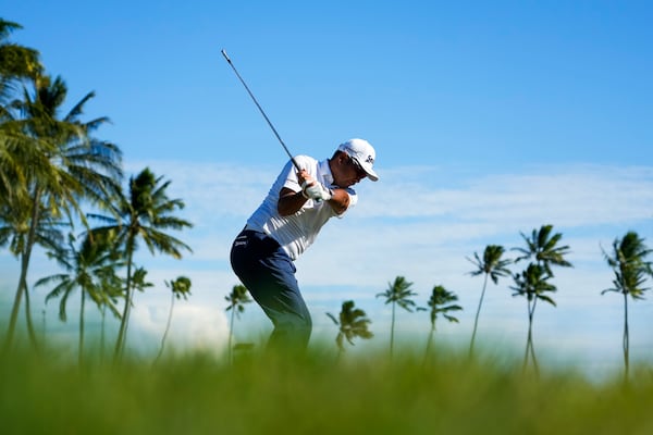 Hideki Matsuyama, of Japan, hits on the 11th hole during the first round of the Sony Open golf event, Thursday, Jan. 9, 2025, at Waialae Country Club in Honolulu. (AP Photo/Matt York)