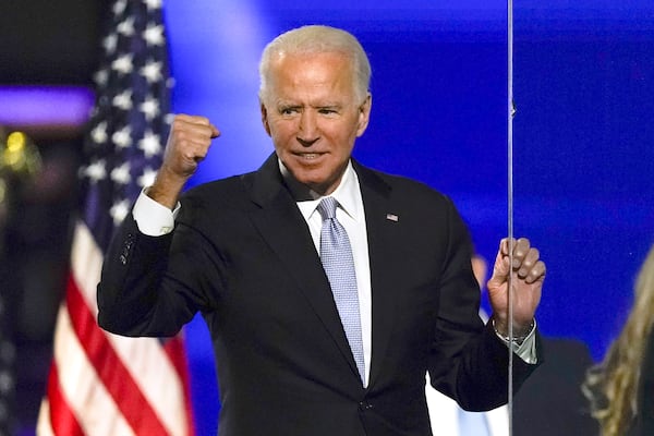 FILE - President-elect Joe Biden gestures to supporters Nov. 7, 2020, in Wilmington, Del. (AP Photo/Andrew Harnik, File)