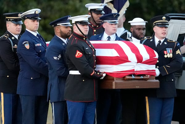 The flag-draped casket of former President Jimmy Carter is carried into Maranatha Baptist Church for a funeral service, Thursday, Jan. 9, 2025, in Plains, Ga. (AP Photo/Mike Stewart)