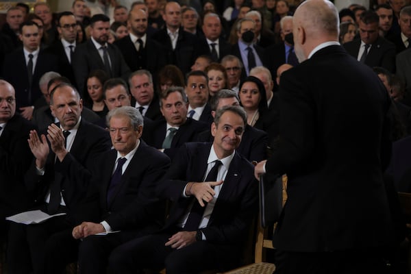 Albania's Prime Minister Edi Rama, right, and his Greek counterpart Kyriakos Mitsotakis, second right, attend the funeral of the late Archbishop Anastasios of Tirana, Durres and All Albania, at the Cathedral of the Resurrection of Christ, in Tirana, Albania, Thursday, Jan. 30, 2025. (AP Photo/Vlasov Sulaj)