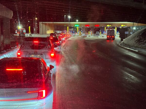 Cars are backed up at the US-Canada border after a shooting involving a U.S. Border Patrol agent in Coventry, VT., Monday, Jan. 20, 2025, in Stanstead, Quebec. (AP Photo/Chloe Jones)