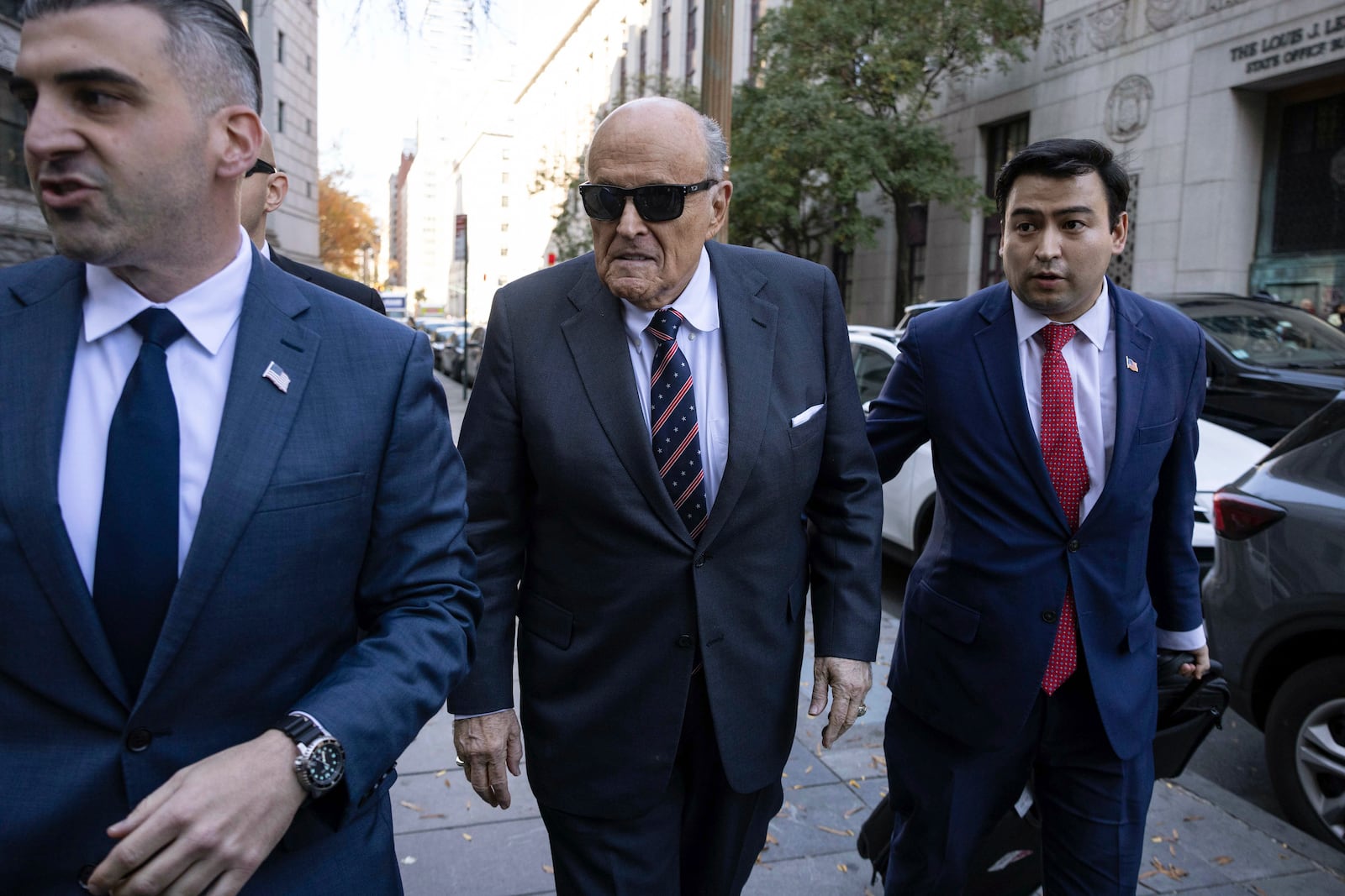 Former New York City Mayor Rudy Giuliani arrives at the court to explain to a federal judge why he hasn't surrendered his valuables as part of a $148 million defamation judgment, in New York, Thursday, Nov. 7, 2024. (AP Photo/Yuki Iwamura)