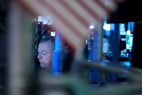 A trader works on the floor at the New York Stock Exchange in New York's Financial District Thursday, Jan. 2, 2025. (AP Photo/Seth Wenig)