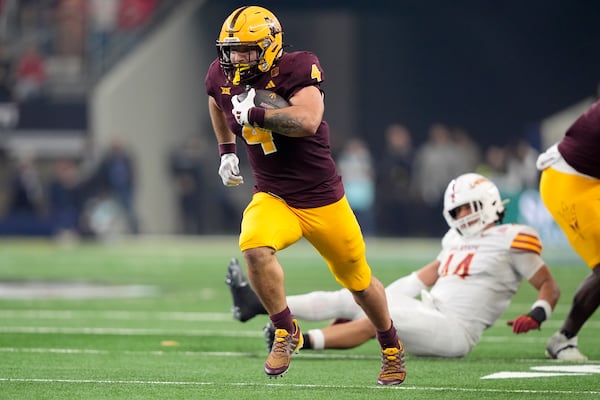 Arizona State running back Cam Skattebo (4) sprints to the end zone for a touchdown in the second half of the Big 12 Conference championship NCAA college football game against Iowa State, in Arlington, Texas, Saturday Dec. 7, 2024. (AP Photo/LM Otero)