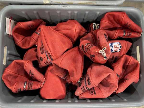 A bin of official balls for the NFL Super Bowl football game wait to be finished inside the Wilson Sporting Goods football factory, Monday, January 27, 2025, in Ada, Ohio. (AP Photo/Patrick Aftoora-Orsagos)