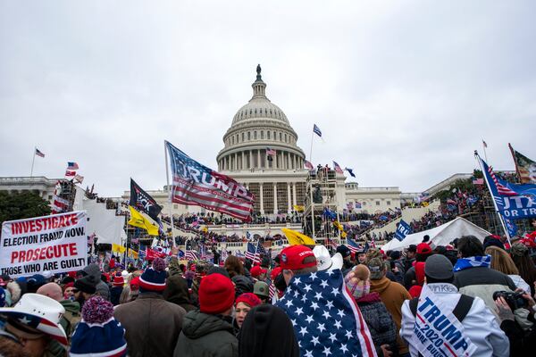 FILE - Rioters loyal to President Donald Trump rally at the U.S. Capitol in Washington, Jan. 6, 2021. (AP Photo/Jose Luis Magana, File)