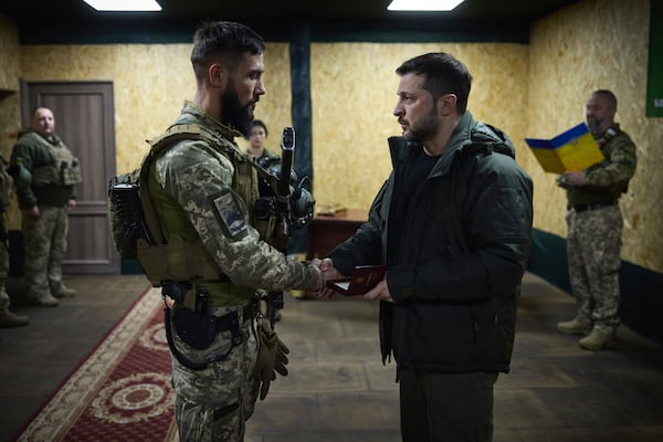 In this photo provided by the Ukrainian Presidential Press Office, Ukrainian President Volodymyr Zelenskyy awards servicemen in the frontline city of Kupiansk, the site of heaviest battles with the Russian troops in the Kharkiv region, Ukraine, Monday, Nov. 18, 2024. (Ukrainian Presidential Press Office via AP)