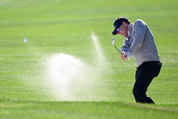 Justin Leonard hits out of a bunker onto the third green during the first round of the PNC Championship golf tournament, Saturday, Dec. 21, 2024 in Orlando. (AP Photo/Phelan M. Ebenhack)